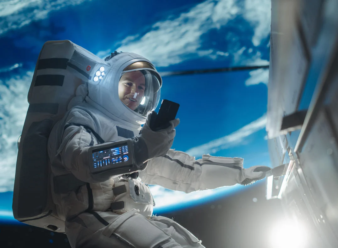 Astronaut working in space and answering a call
