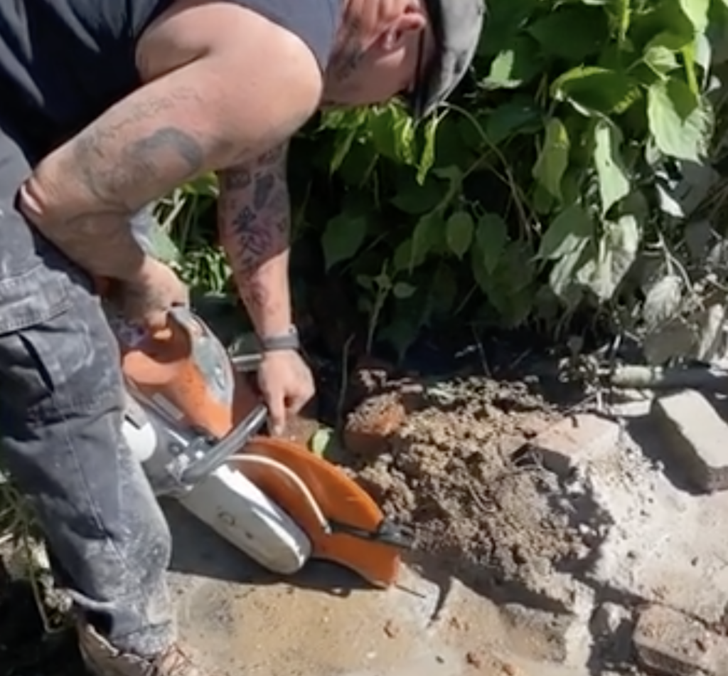 owner of Cesspool Pros working in a cesspool