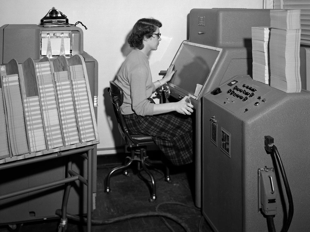 A staff member from the Computing Section at NACA Operates an IBM Telereader