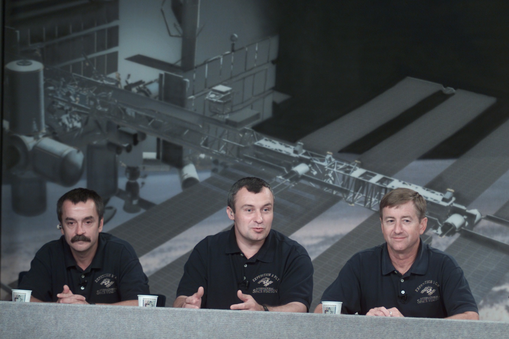 astronauts answering questions at press conference